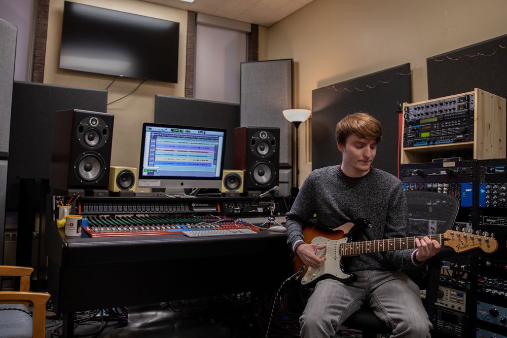 music composition student works in a studio