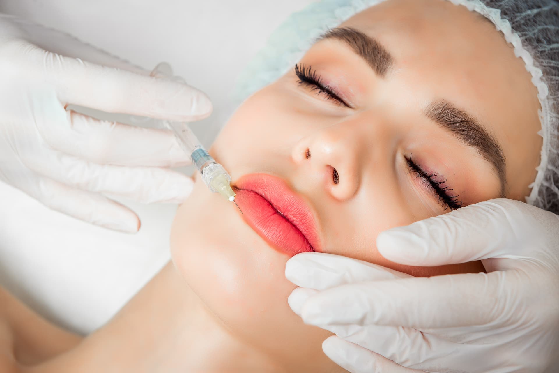 woman receiving injection into lip