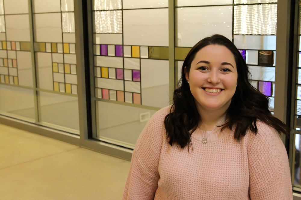education student sits inside James Hall