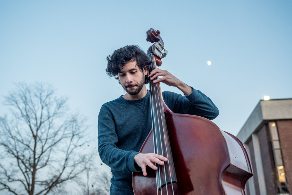 Jazz student practices outside Wilson Hall.