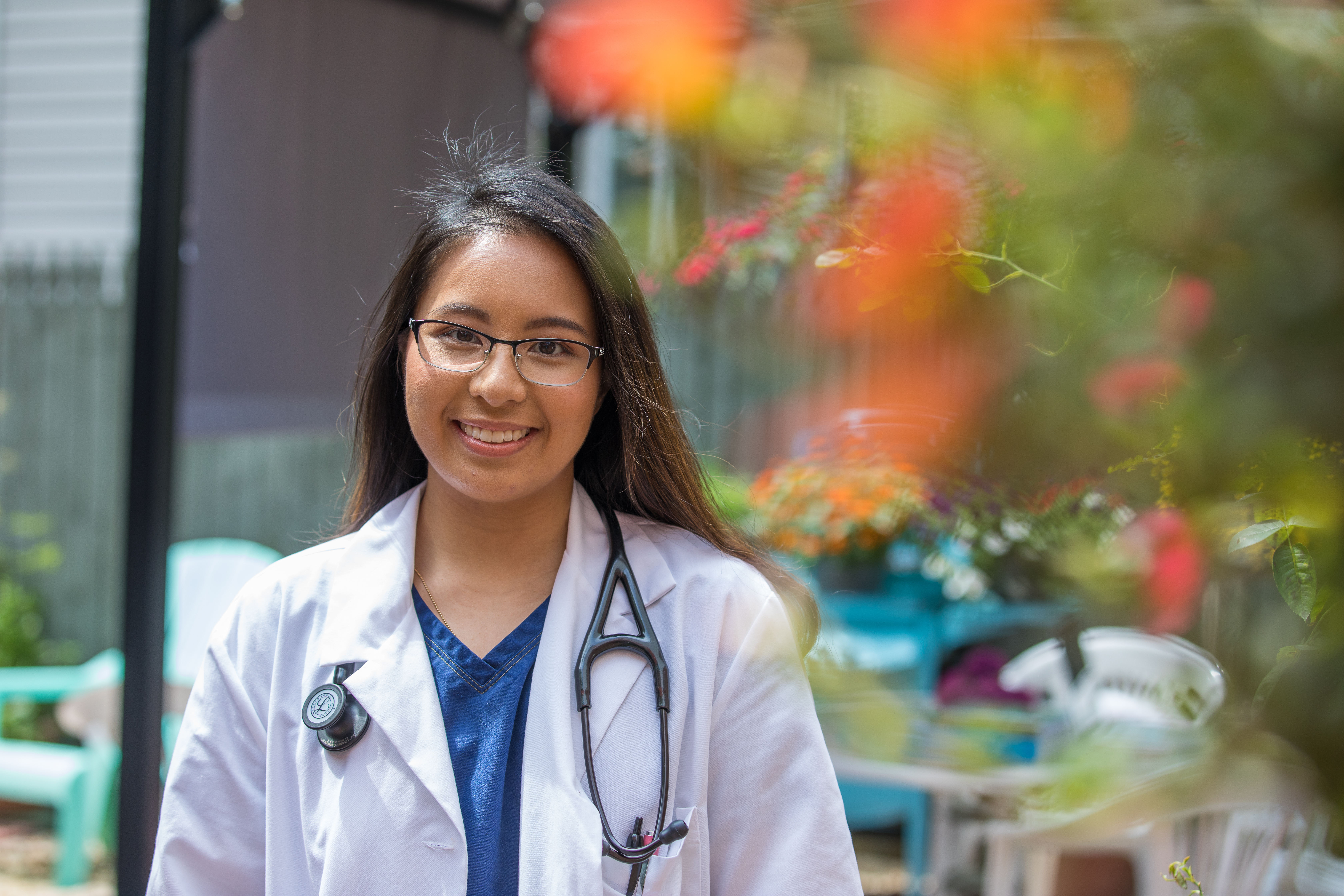 Rowan nursing student by the fountains near Rowan Boulevard