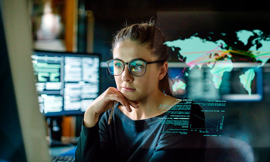 woman looking at data on computer
